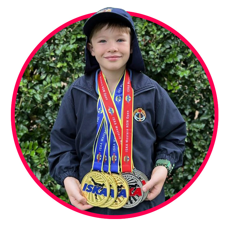 Boy with sports medals from St Margaret Mary's Catholic Primary Merrylands