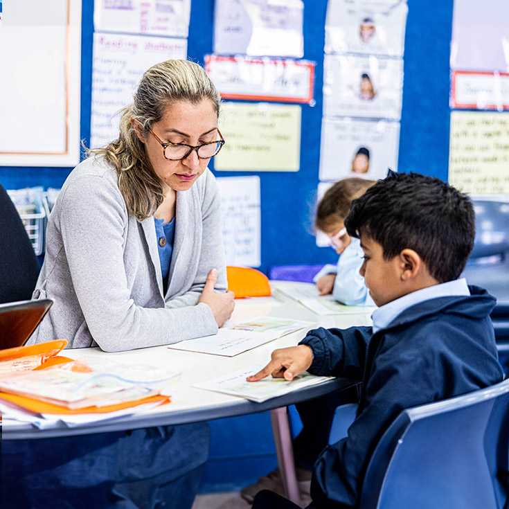 Teacher supporting student at St Margaret Mary's Catholic Primary Merrylands
