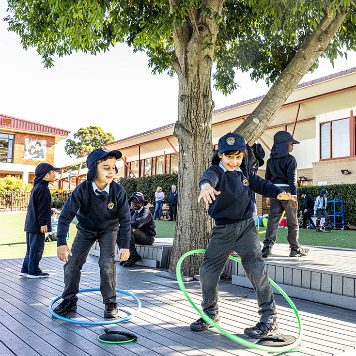 Kids with hula hoops at St Margaret Mary's Catholic Primary Merrylands